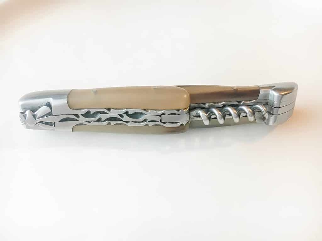 Laguiole knife on its side, closed.
