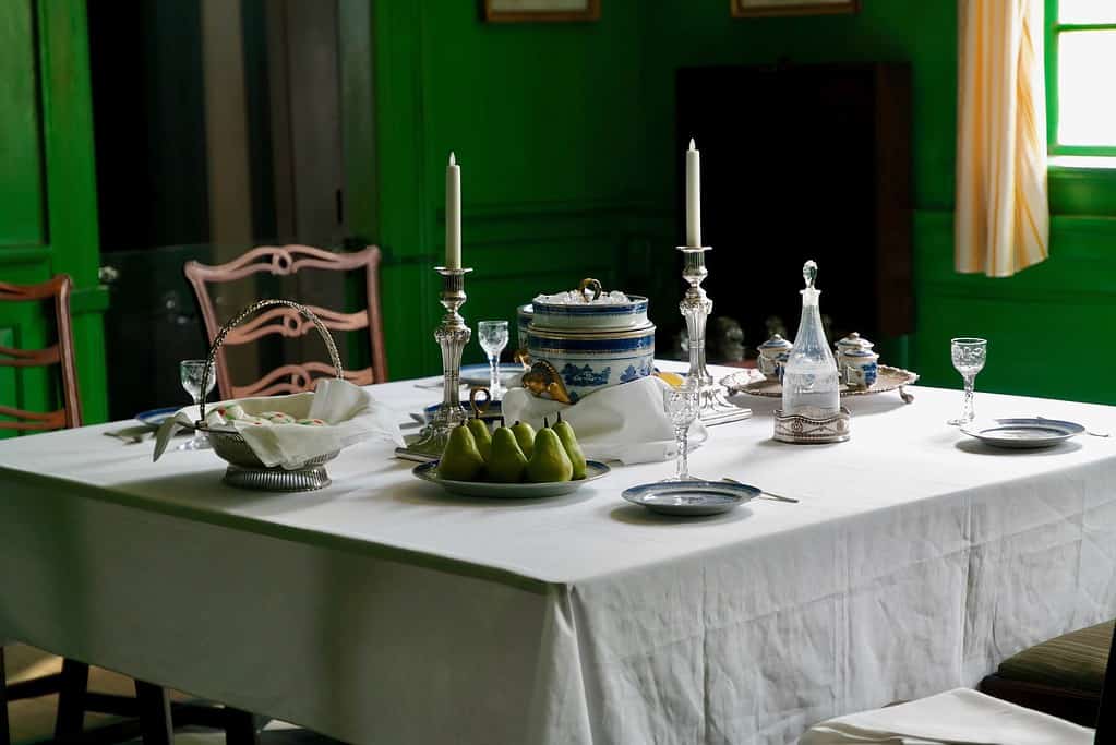 Table set with nice dinnerware and tablecloth