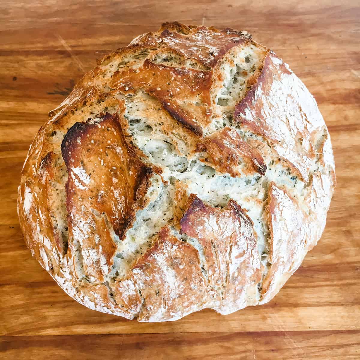 Round rustic bread with herbs