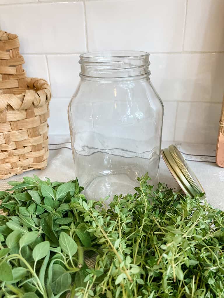 clear glass jar with herbs