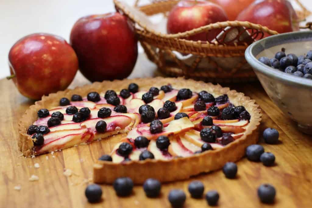 Apple Blueberry Tart with slice missing