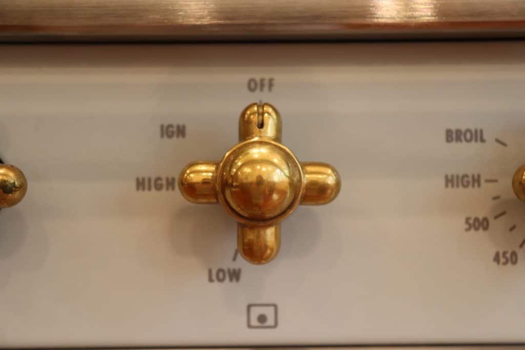 Close up of a brass knob on a Lacanche range