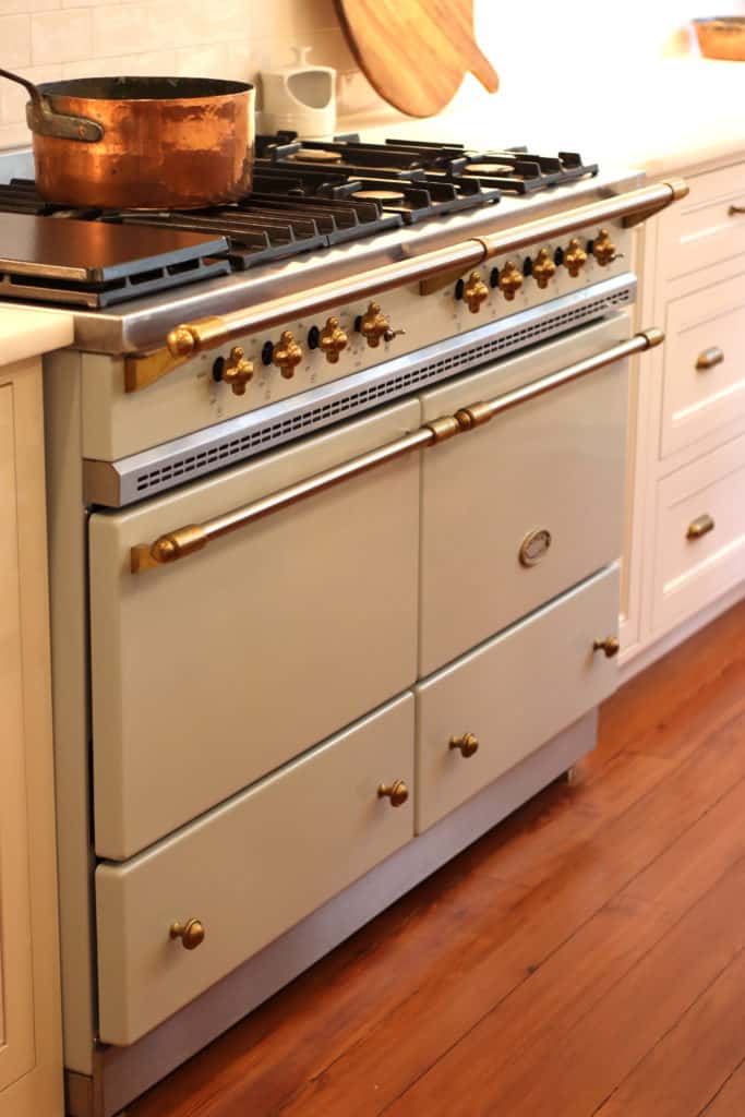 Lacanche Range in a kitchen with a copper pot on top