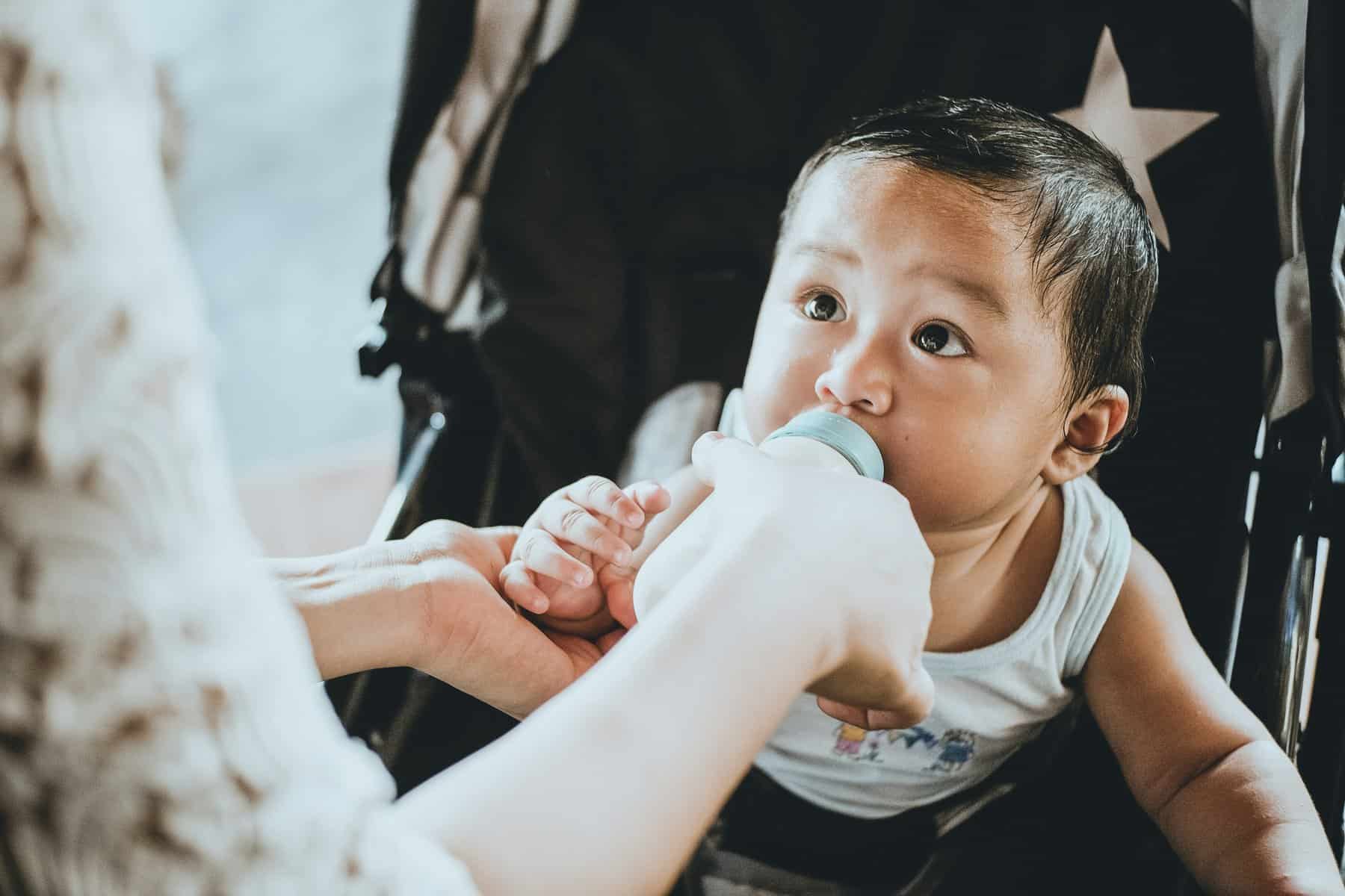 Mother feeding baby a bottle