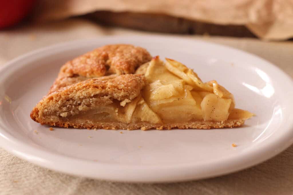 Sweet French apple galette with a flaky crust and tender apple filling, perfect for a classic French dessert or afternoon treat.