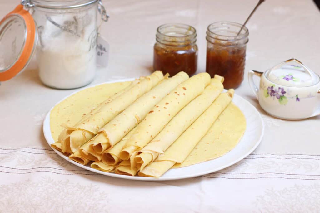 Delicious homemade crepes served with jam and honey, perfect for a cozy French breakfast or brunch. Experience authentic French cuisine with traditional crepes and sweet toppings.