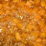 Pumpkin jam cooking in a pot.
