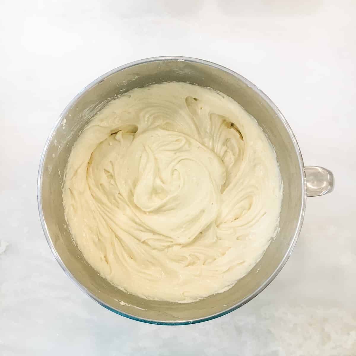 mixing bowl with cake batter in it